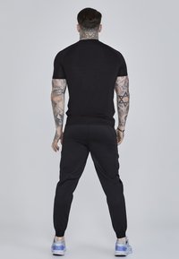 SIKSILK JOGGERS - Tracksuit bottoms - black