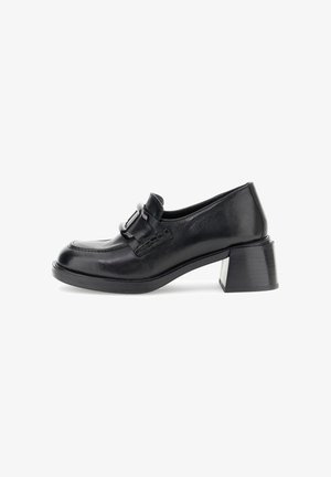 Zwarte leren blockhak schoenen met een ronde neus en een decoratieve gespsierraad. Gladde textuur en een lichte glans op het oppervlak.