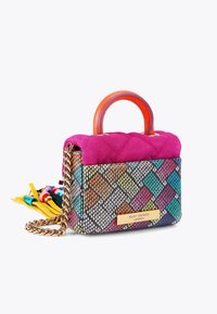 Small handbag in pink suede and multicolored woven fabric, featuring a quilted top, chain strap, and colorful tassels. Gold logo plate attached.