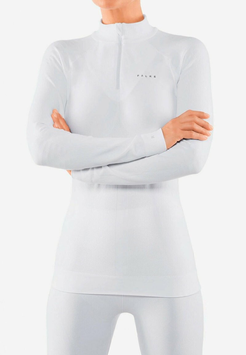 Witte lange mouwen sporttop met hoge kraag, ritssluiting, geribbeld textuur en FALKE branding op de borst; aangesloten ontwerp.