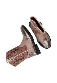 Pink leather ankle boots with metallic accents, intricate perforated patterns, textured surfaces, and a low black rubber sole.