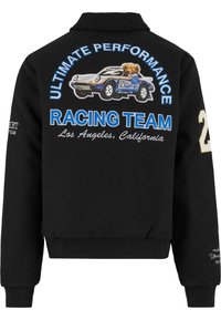 Black bomber jacket featuring a graphic of a bear in a race car, "RACING TEAM" text, and contrasting blue and gold accents.