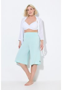 Lichte, mintgroene culottes met een brede tailleband en een ontspannen fit. Kenmerkt zich door een zachte stof en een vloeiende broekspijp.
