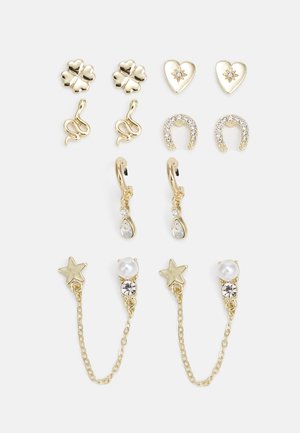 Kuldsõrmuste komplekt, mis sisaldab erinevaid mudeleid: ristikhein, süda, madu, hobuseraua ja täht. Komplektil on kaunistatud detailsed elemendid ja pärlite aksendid.