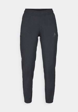 Black athletic pants made of soft fabric; features an elastic waistband, tapered legs, and side pockets, with a logo on the left thigh.