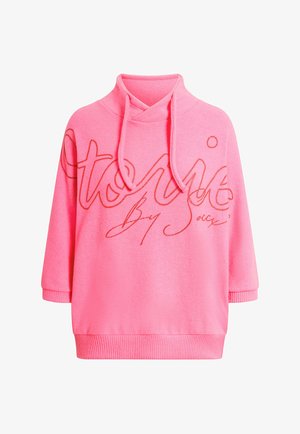 Leuchtend pinker Hoodie mit gerippten Bündchen und Saum, versehen mit großem kursivem Schriftzug auf der Brust und verstellbaren Kordeln am Kragen.