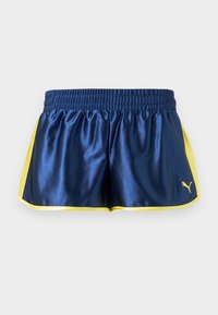 Μπλε σκούρο αθλητικό σορτς με κίτρινες πλαϊνές λωρίδες και επένδυση, ελαστική μέση και μικρό κίτρινο λογότυπο Puma στο κάτω δεξί μέρος.