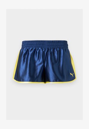 Μπλε σκούρο αθλητικό σορτς με κίτρινες πλαϊνές λωρίδες και επένδυση, ελαστική μέση και μικρό κίτρινο λογότυπο Puma στο κάτω δεξί μέρος.