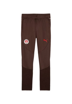 Bruine sportbroek met een gestructureerd ondergedeelte, elastische tailleband, rode Puma-logo en een FC St. Pauli-patch op de dij.