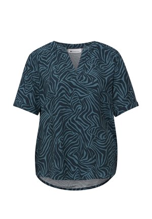 Blouse à manches courtes avec encolure en V, motif zèbre bleu et noir, et ourlet légèrement arrondi.
