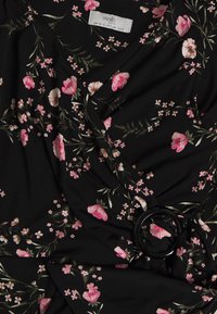 Black floral wrap dress featuring pink flowers and green leaves. Includes a round black buckle detail on the waist. Soft fabric texture.