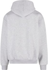 Sudadera con capucha gris de corte relajado, con una textura suave y puños y dobladillo acanalados, mostrada por la parte de atrás.