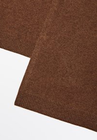 Brown knitted fabric with a smooth texture, featuring ribbed hems at the bottom. The material displays a soft, even color throughout.