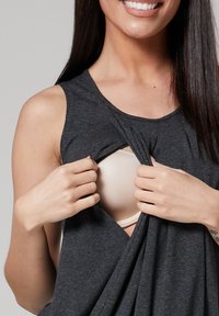 Gray sleeveless blouse pulled to reveal a light beige bra underneath, made from soft fabric, with a relaxed fit and draped design.