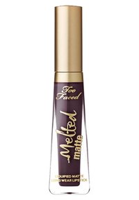 Dark plum Too Faced Melted matte liquid lipstick with gold cap and gold lettering on clear tapered tube.