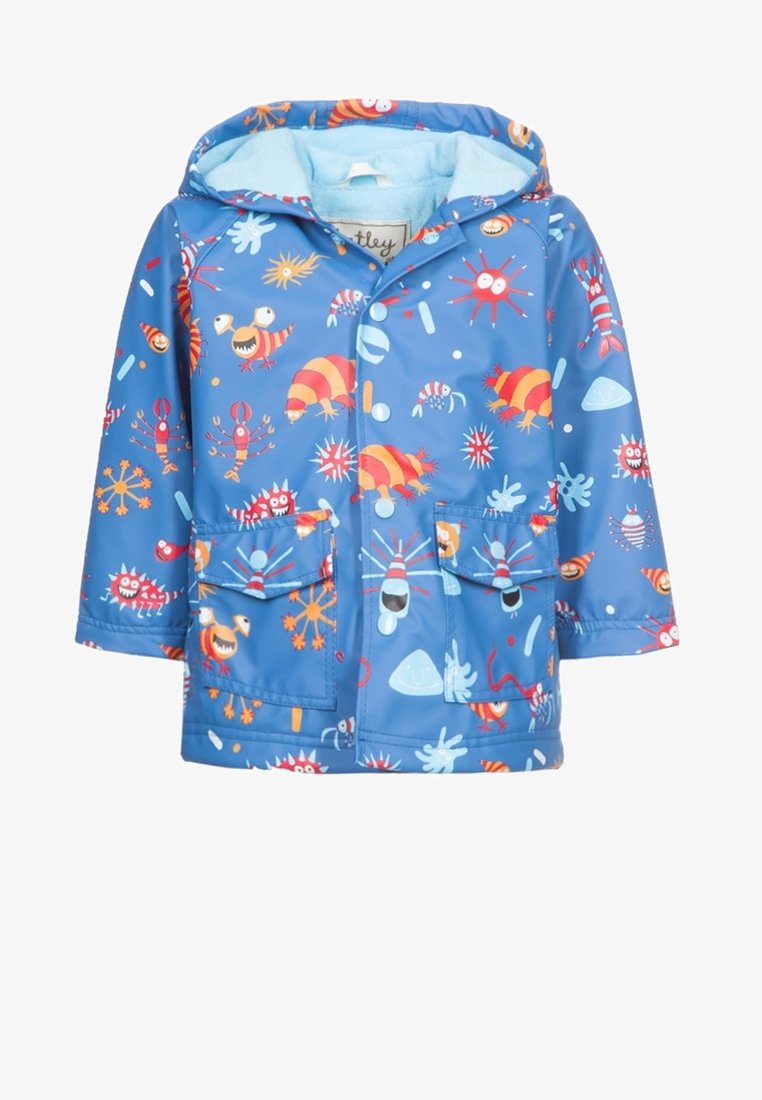 Waterproof children's raincoat in bright blue with colorful marine-themed patterns, featuring a hood and two front pockets. Soft lining inside.