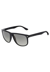 Ochelari de soare din plastic negru cu lentile degradate. Formă pătrată cu margini curbate, având accente metalice argintii și un interior texturat pe brate.