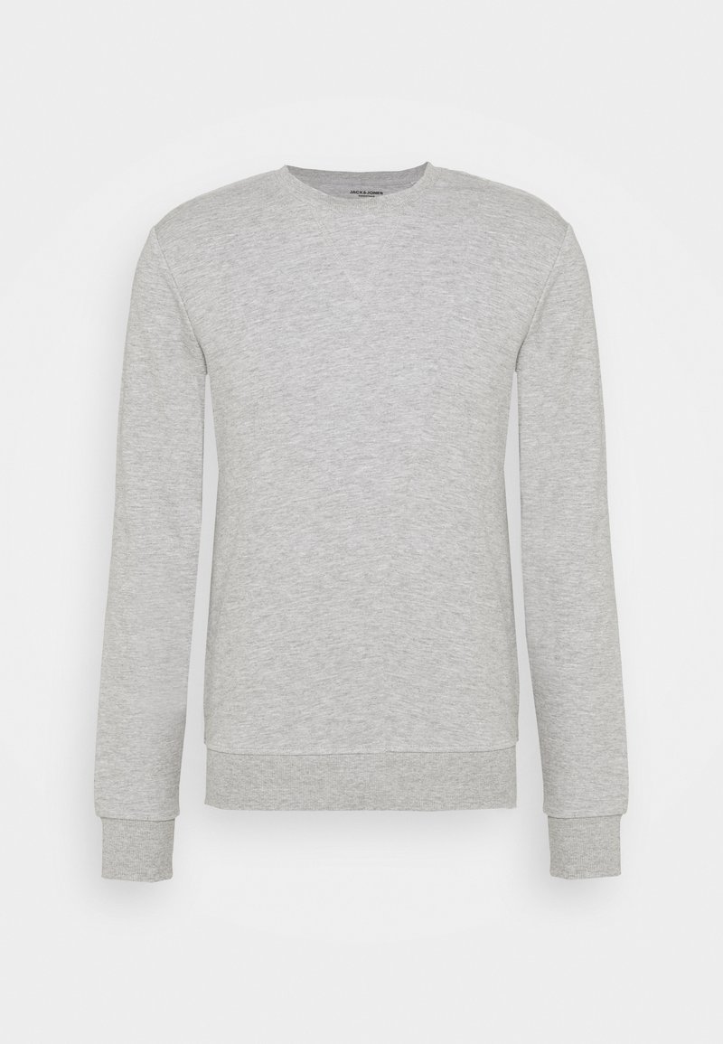 Sudadera gris de manga larga, con puños acanalados y escote redondo. Confeccionada en una tela suave con una textura lisa y un diseño minimalista.