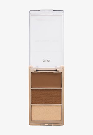 Kompakt makeup-palette med tre nuancer: mørkebrun creme, mellembrun pudder med præget tekst og lys beige pudder.