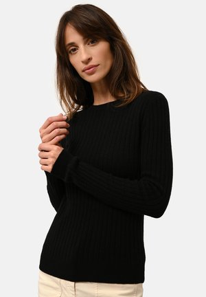 Maglione nero a coste con maniche lunghe, collo a giro e un design aderente. Tessuto morbido con una finitura liscia, adatto per essere indossato a strati.