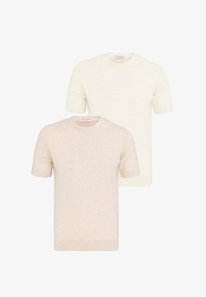 Dos jerséis de punto de manga corta y cuello redondo en crema y beige, mostrados de frente sobre un fondo blanco.