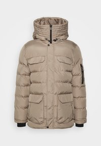 Giacca imbottita beige con collo alto, zip frontale e quattro tasche. Presenta dettagli neri e coulisse regolabile nel cappuccio.