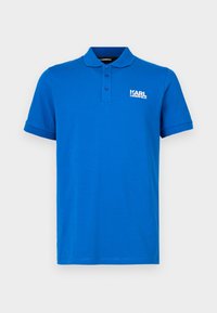 Modra polo majica iz gladkega bombaža z ovratnikom, trirazporednim zapenjanjem na gumbe in belim logotipom "KARL LAGERFELD" na levi strani prsnega dela.