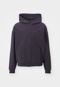 Purple zip-up hoodie featuring a large hood, front pockets, and a small embossed logo on the chest. Made of soft, textured fabric.