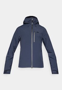 Casaco azul-marinho impermeável com capuz, apresentando um fecho frontal e dois bolsos laterais, feito de um material liso e durável.