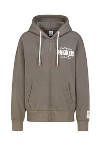 Olijfgroene zip-up hoodie van katoen, met een kangoeroezak, witte trekkoorden en tekst aan de voorkant die luidt: "C'est toujours MAGIQUE."