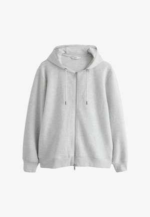 Pelēka zipa kapuce džemperis ar reljefainu ribotu rakstu, garām piedurknēm, regulējamām auklām un brīvi pieguļošu fitu. Mīksts audums ar kapuci.