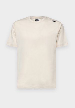 T-shirt s kratkimi rokavi v off-white bombažu, s krožnim ovratnikom in majhnim črnim logotipom na levem ramenu. Gladka tekstura.