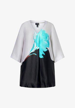 Túnica blanca, negra y verde azulado con mangas tres cuartos, escote en V y patrón floral abstracto centrado en la parte delantera.