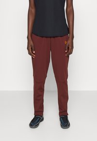 Nike Performance - ACADEMY  WINTERIZED - Tracksuit bottoms - bronze eclipse/total orange Thumbnail Image 1