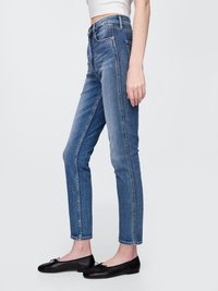 Jeans de ganga azul com cintura alta, corte slim e design de cinco bolsos. Apresentam uma bainha cropped e um desbotado subtil para um look moderno.