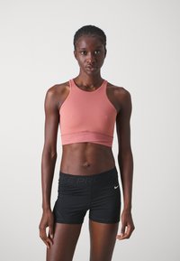 Nike Performance TWIST BRA - Neliela atbalsta sporta krūšturis - canyon pink