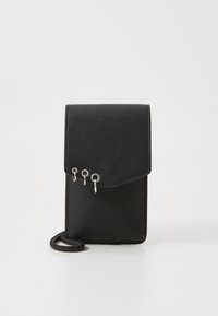 Black leather crossbody bag with a flap closure, featuring three silver metal rings as accents and a thin strap. Smooth texture.