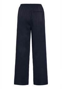 Marineblaue weite Hosen mit einem elastischen Bund und einer einzigen Gesäßtasche, gefertigt aus einem glatten Stoff mit einem lockeren Schnitt.
