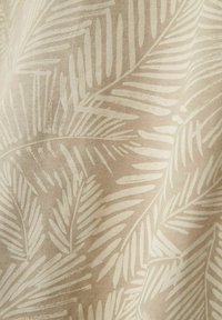 Beige fabric with a repeating white palm leaf pattern, featuring a soft texture and smooth finish, suitable for upholstery or drapery.
