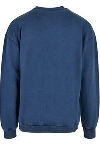 Sweat-shirt bleu marine à manches longues avec col rond, poignets et ourlet côtelés, vu de dos sur fond blanc.