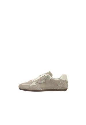 Beige low-top casual sneaker with suede and fabric panels, white laces, and a thin brown sole, shown in side profile.
