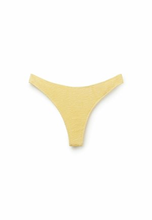 Perizoma da donna in tessuto giallo strutturato, mostrato in piano su sfondo bianco.