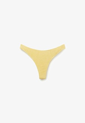 Perizoma da donna in tessuto giallo strutturato, mostrato in piano su sfondo bianco.