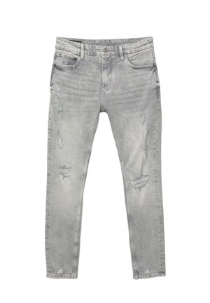 Jean skinny gris clair avec des patches déchirés sur les cuisses et les genoux, design à cinq poches et fermeture à bouton.