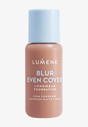 Lumene Blur Even Cover foundation bottle with light blue cap, high coverage, longwear, and luminous matte finish text on brown container.