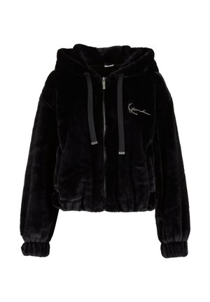 Fekete, rövidített kapucnis pulóver, puha műszőrméből készült, elöl cipzáros, kapucnija zsinórral állítható, rugalmas mandzsettákkal. Hímzett logó részletet tartalmaz.