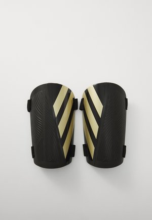 TIRO UNISEX - Shin pads - black/gold-coloured/white