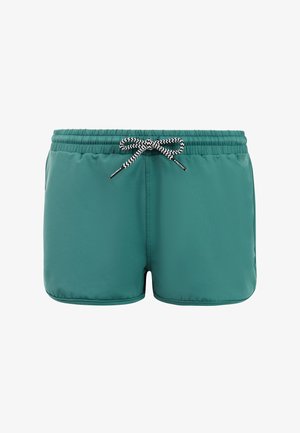 Turquoise zwembroek met elastische tailleband en zwart-wit zigzagkoord, vooraan in het midden gestrikt als een strik.