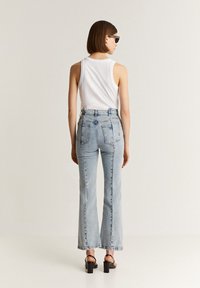 Scalpers BACK SEAM  - Flared jeans - light indigo