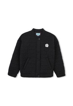 Veste matelassée noire avec boutons-pression, deux poches avant et un petit logo circulaire blanc sur la poitrine portant l'inscription "Kenzo Paris."